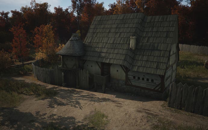 A close-up screenshot of the Manor building during the autumn in Manor Lords