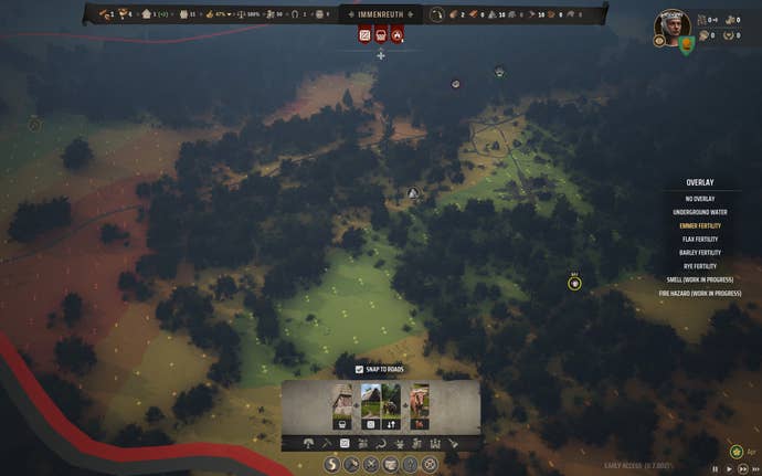 An overhead map of a forested region showing a soil fertility overlay in Manor Lords