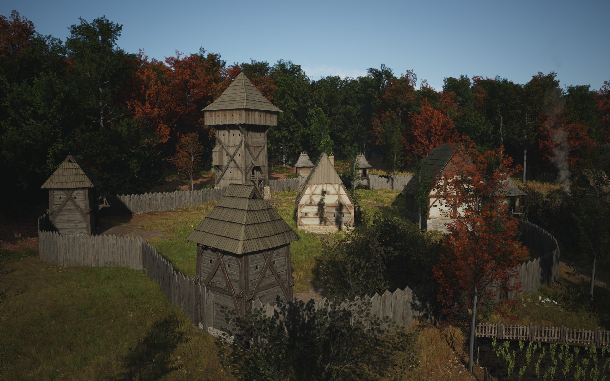 A view of a well developed Manor building inside wooden walls in Manor Lords