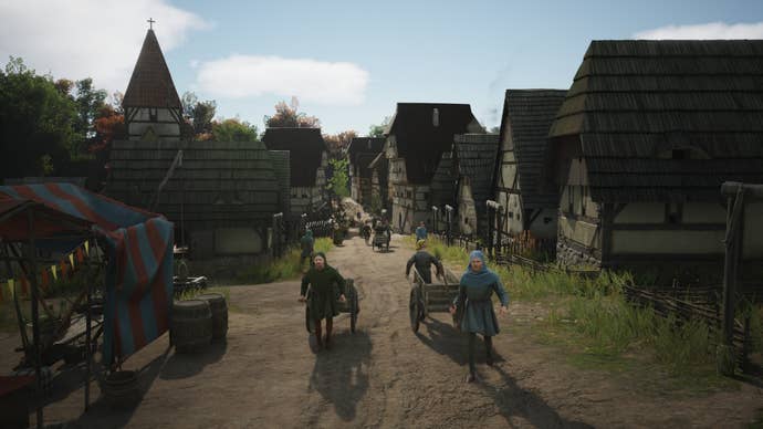 A bustling village street with citizens pulling carts between houses in Manor Lords