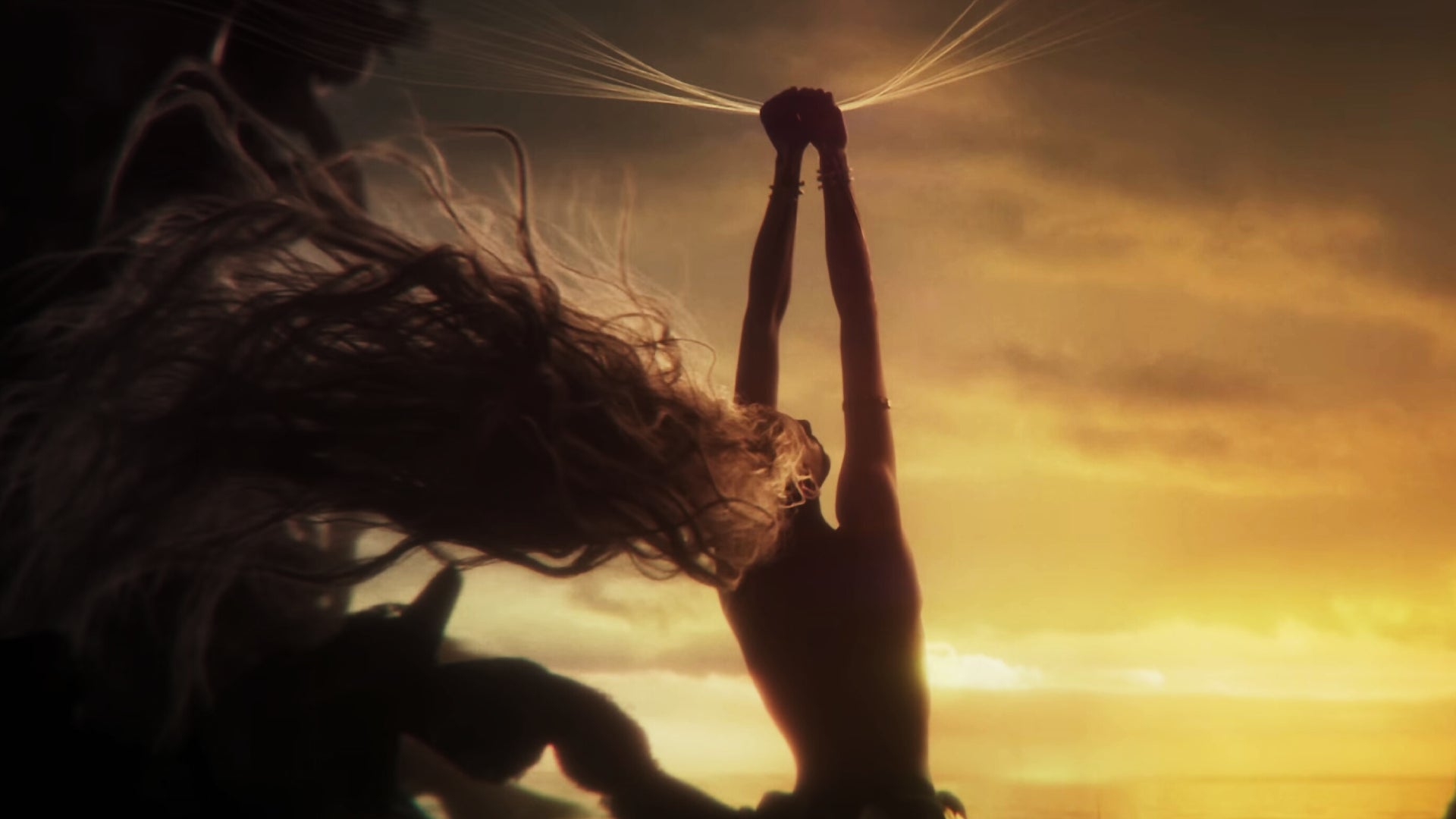 Marika holds up golden threads from the Elden Ring in the trailer for Shadow of the Erdtree. - 1