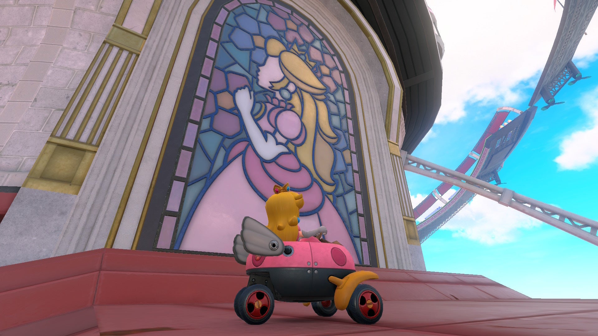 Peach can be seen sitting on the rooftop of Peach's Castle looking at a stained glass window depicting Peach in Mario Kart World - 4