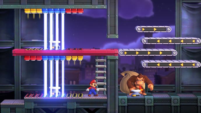 Mario faces Donkey Kong in a boss fight featuring laser gates