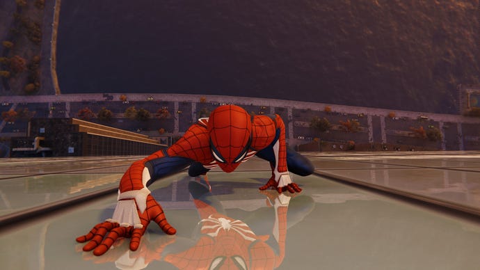 Spider-Man climbs the outside of a skyscraper in Marvel’s Spider-Man Remastered.