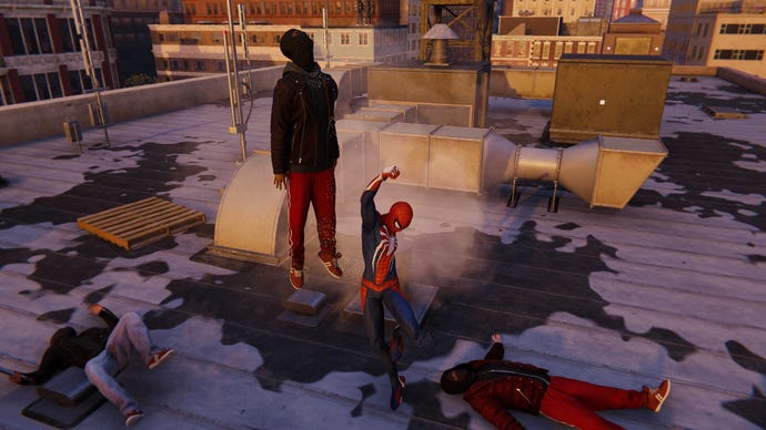 Spider-Man uppercuts a thug in Marvel’s Spider-Man Remastered.