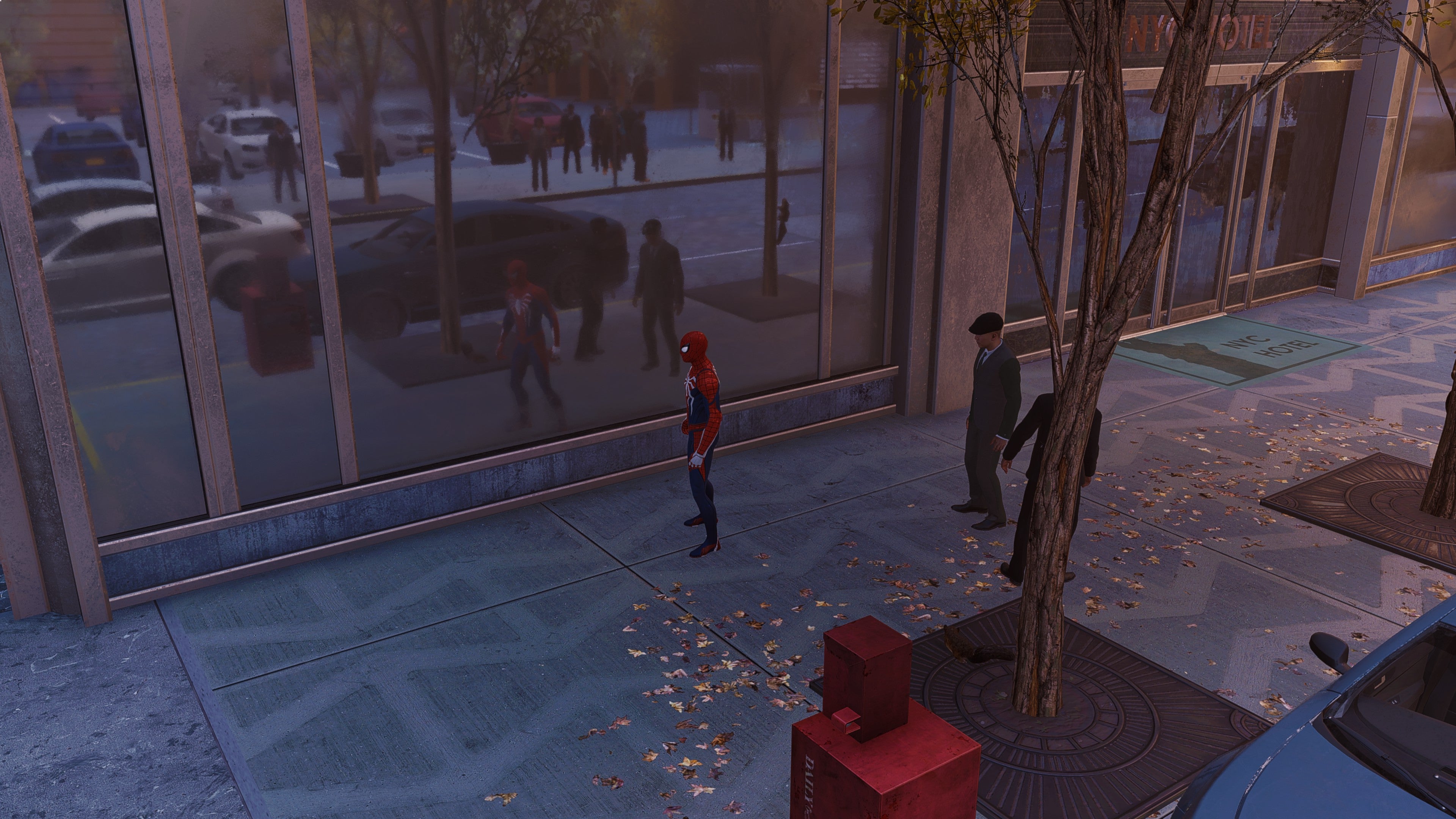 Spider-Man stands in front of a window in Marvel&rsquo;s Spider-Man Remastered, with ray tracing enabled.