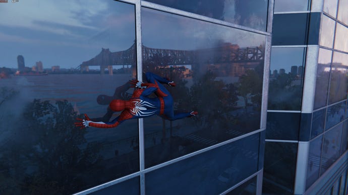 Spider-Man is reflected in a window, with the aid of ray traced reflections in Marvel’s Spider-Man Remastered.