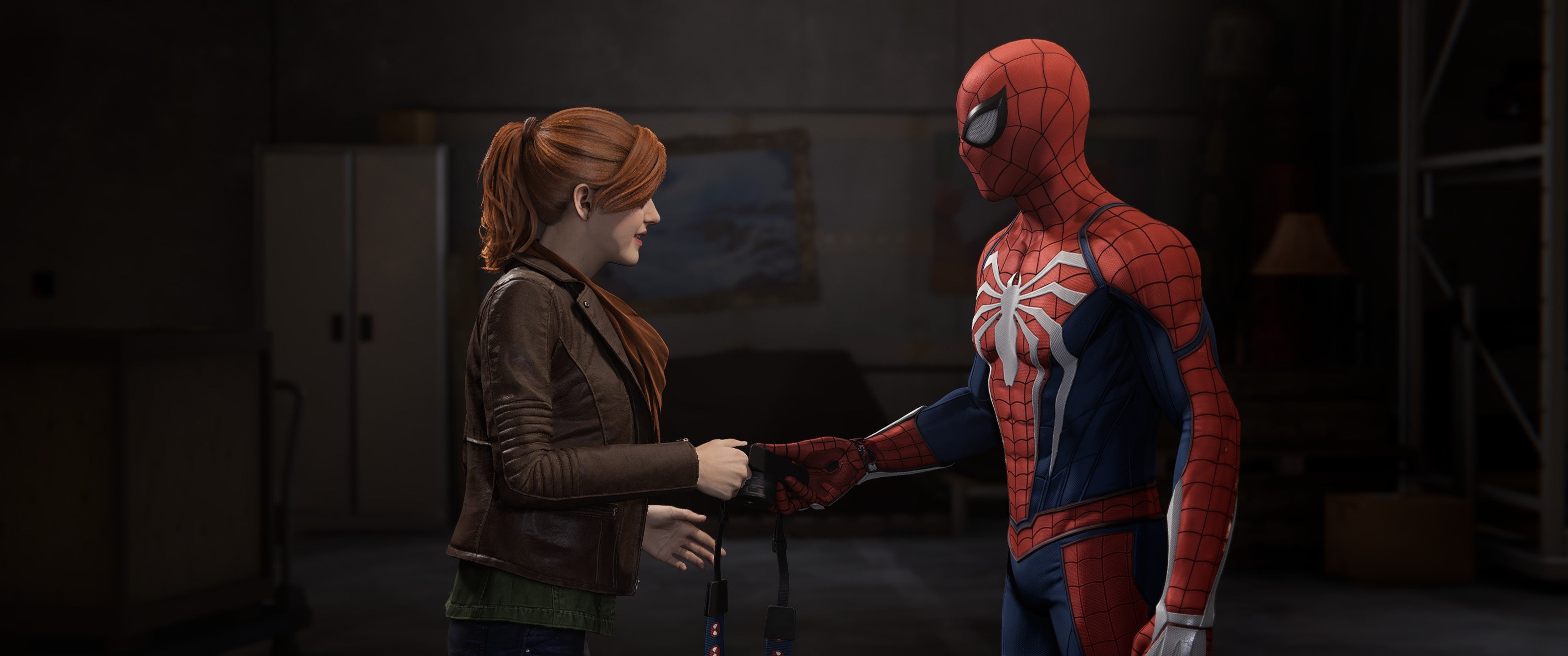 Spider-Man hands Mary Jane Watson her camera in Marvel&rsquo;s Spider-Man Remastered.