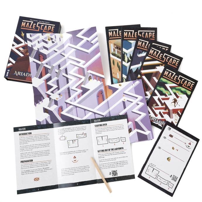 A photo of a pile of paper leaflets for the game Mazescape - a game about drawing mazes. And it's mazes we see on these booklets here.