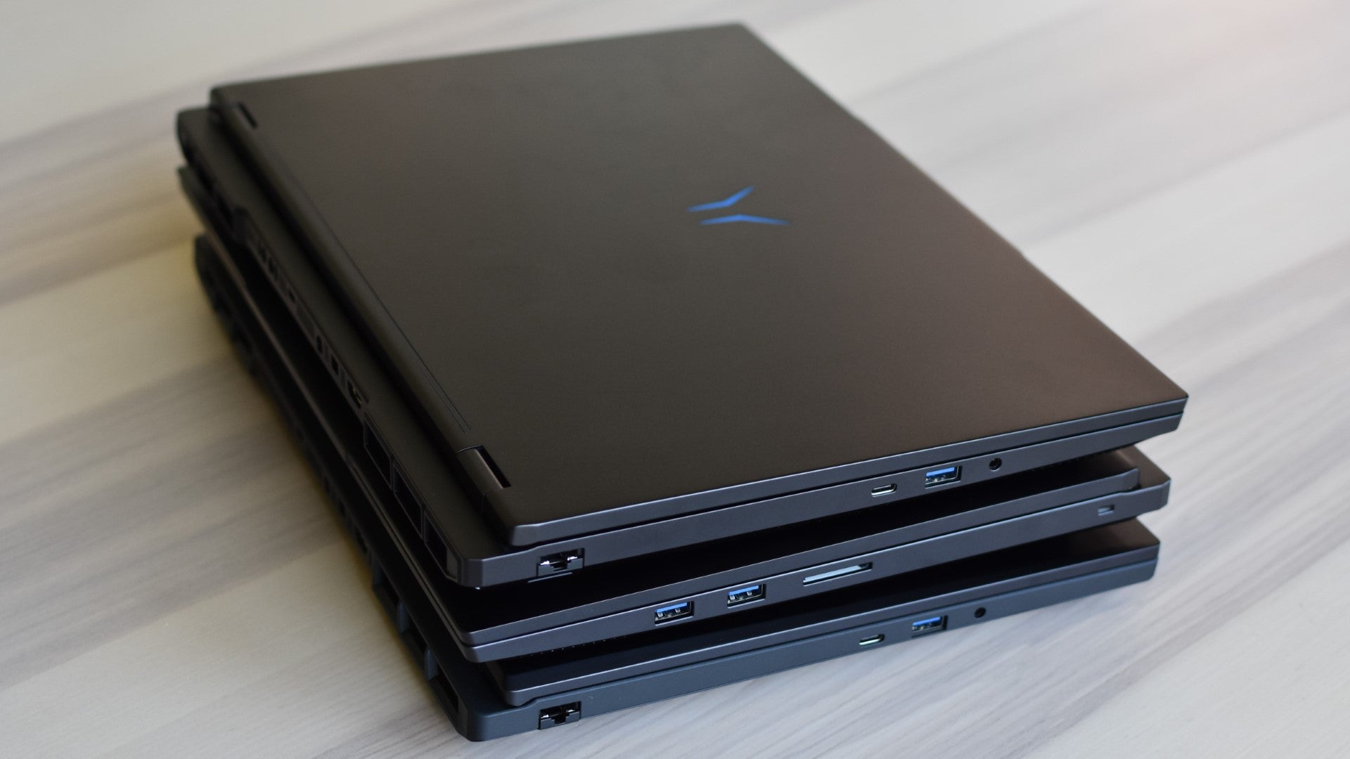 Three Medion Erazer RTX 50 gaming laptops stacked on top of each other. - 8