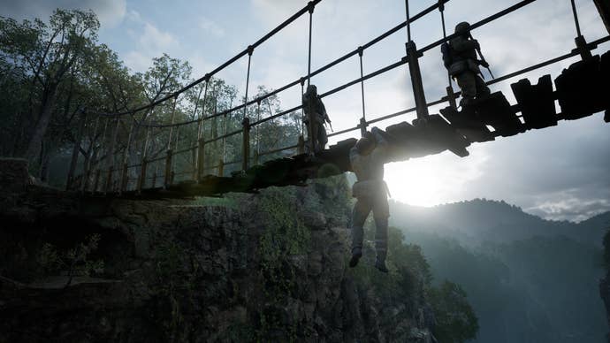 Metal Gear Solid Delta Snake Eater screenshot showing Snake hanging off the edge of a bridge as soldiers patrol
