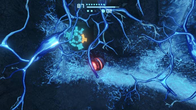 As the Morph Ball, Samus is beside an artifact in Metroid Prime Remastered