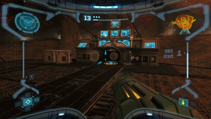 Samus looks at a Morph Ball slot at the Monitor Station in Metroid Prime Remastered
