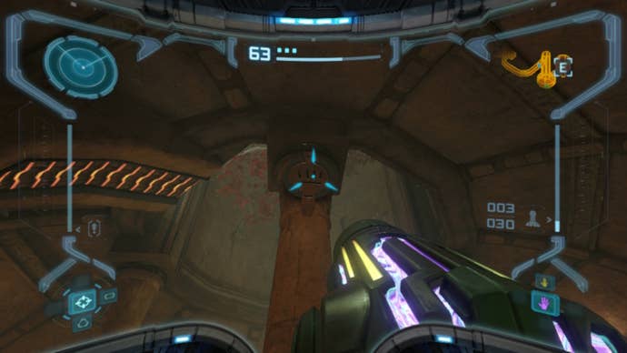 Samus aims at a rune on a pillar in Metroid Prime Remastered