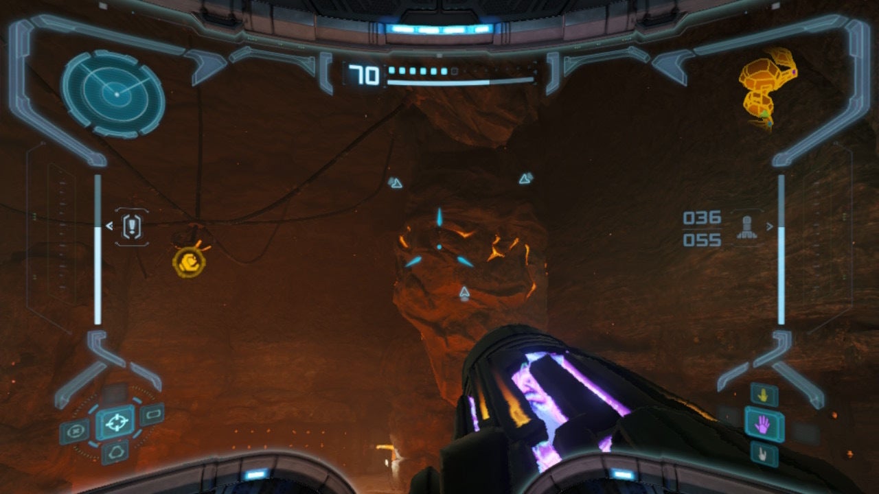 Samus aims at a rock in Twin Fires in Metroid Prime Remastered