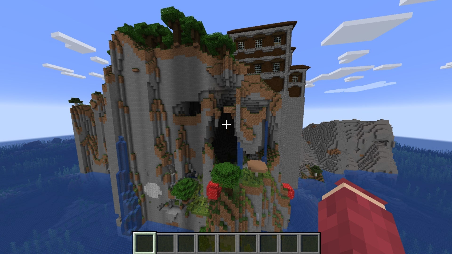The player looks at a huge cliff island with a dark forest and woodland mansion atop it in Minecraft - 16