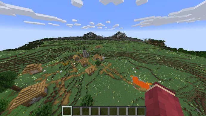 The player looks down at a large flat plains biome with a village in it in Minecraft