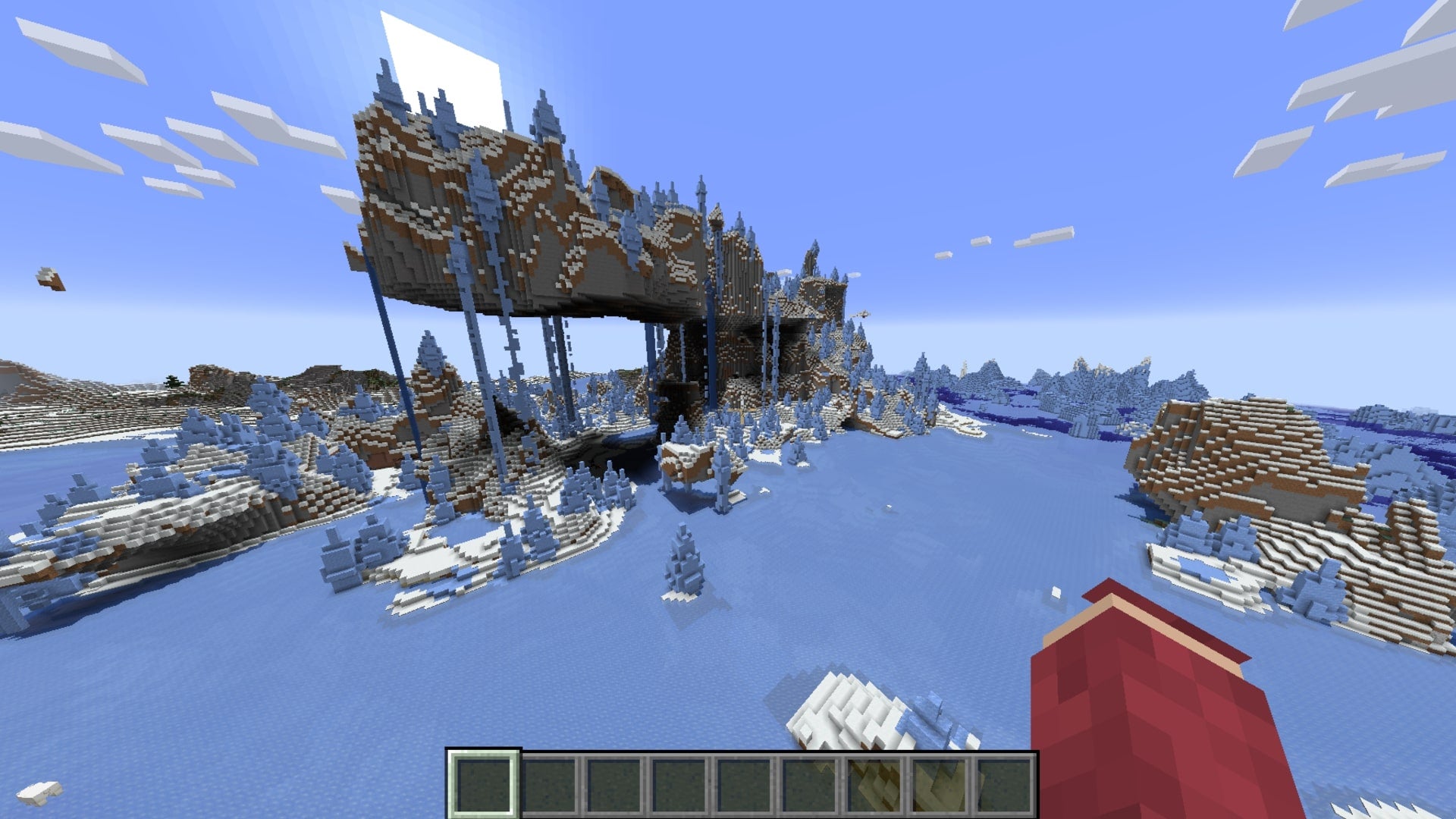The player looks over at a floating mountain in the middle of an icy biome in Minecraft