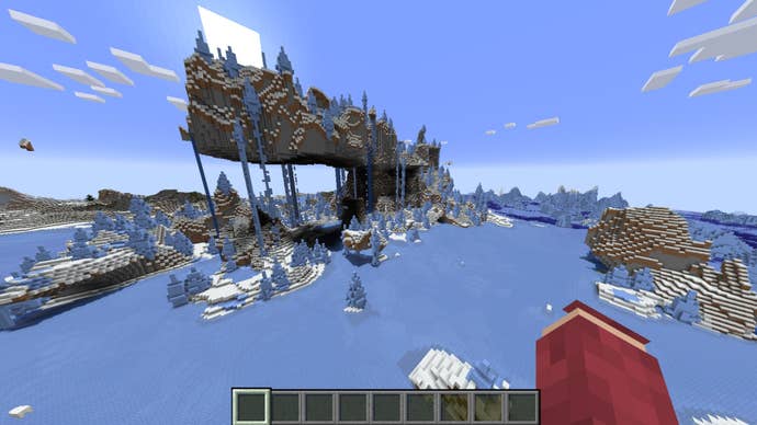 The player looks over at a floating mountain in the middle of an icy biome in Minecraft