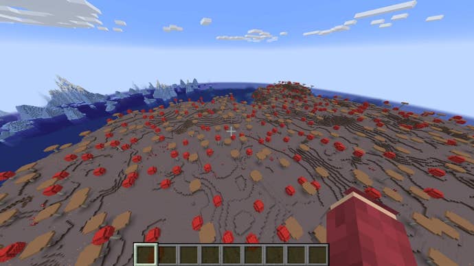 The player looks down at a huge mushroom island with some icebergs in the distance in Minecraft