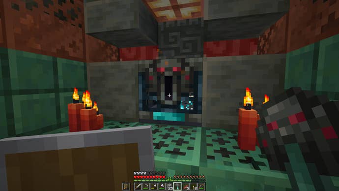 Approaching an Ominous Vault with its key in Minecraft.