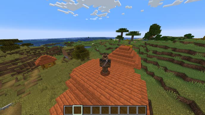 The player, wearing the Chewbacca skin, stands atop a house in a savanna village in Minecraft