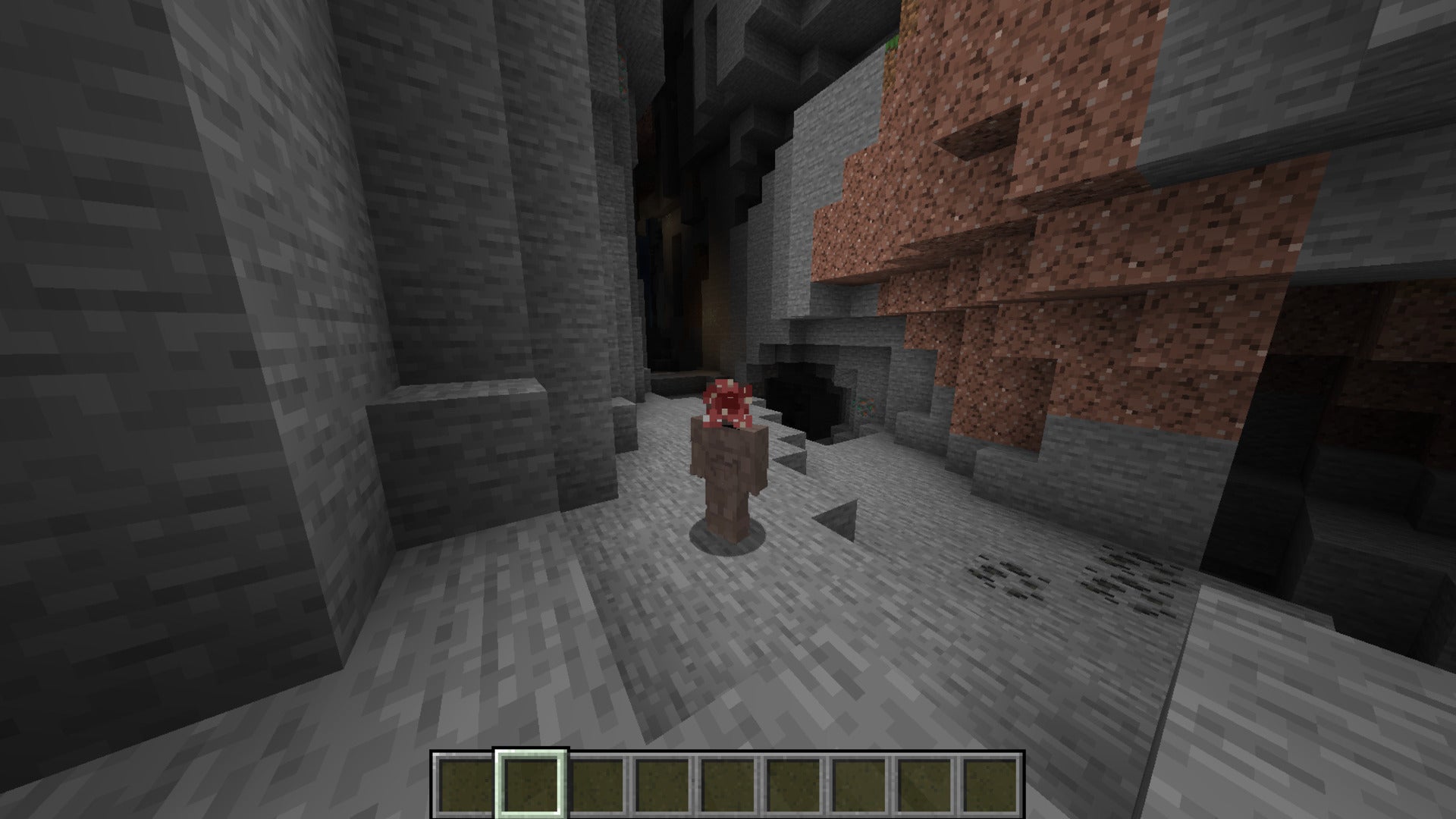 The player, wearing the Demogorgon skin, stands in a cave in Minecraft - 36