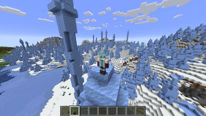 The player is wearing a Hatsune Miku skin while standing on top of an ice spike in Minecraft