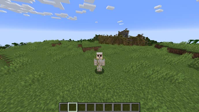 The player, wearing the Iron Golem skin, stands in the plains biome in Minecraft