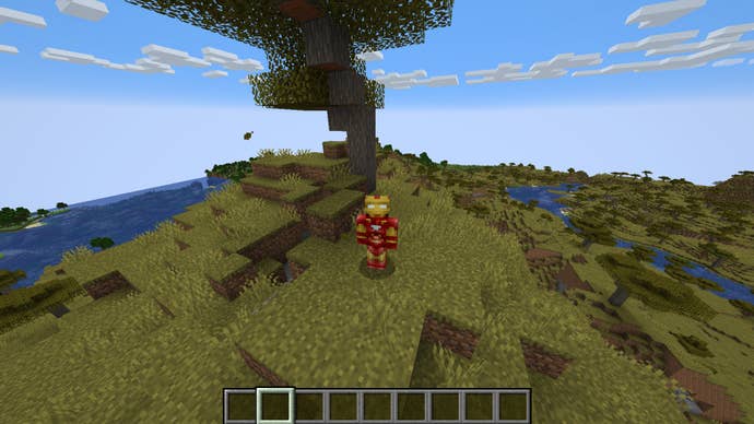 The player, wearing the Iron Man skin, stands in a savanna biome in Minecraft