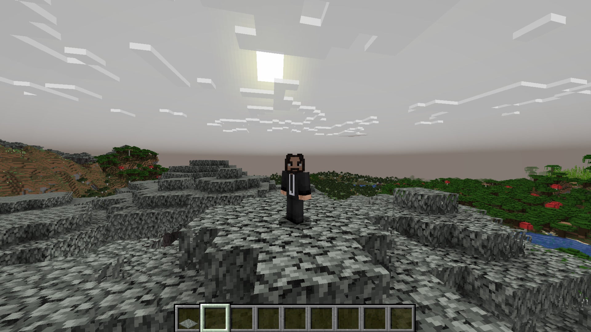 The player is wearing a John Wick skin while standing on top of a tree in the pale garden biome in Minecraft
