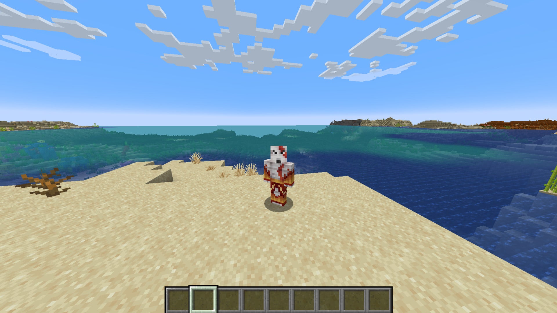 The player, wearing the Kratos skin, stands on a beach in Minecraft