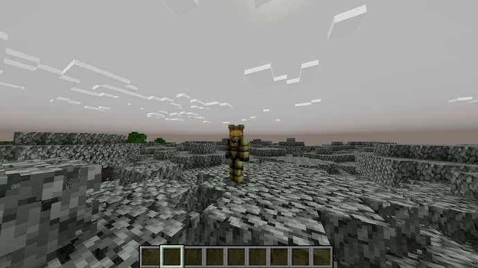 The player, wearing the Master Chief skin, stands atop a tree in the pale garden biome in Minecraft