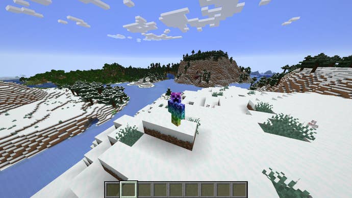 The player, wearing the Rainbow Creeper skin, stands in a snowy biome in Minecraft