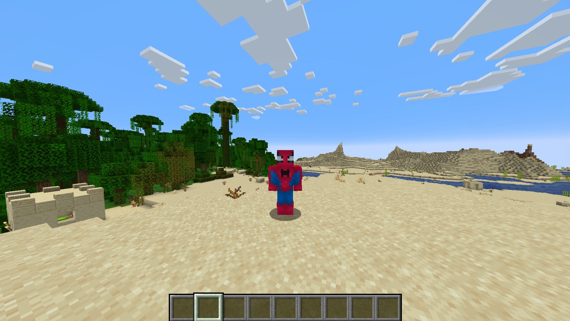 The player is wearing a Spider-Man skin while standing on a beach in Minecraft - 17