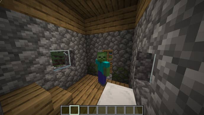 The player, wearing the Zombie skin, stands in the middle of a house in a plains village in Minecraft