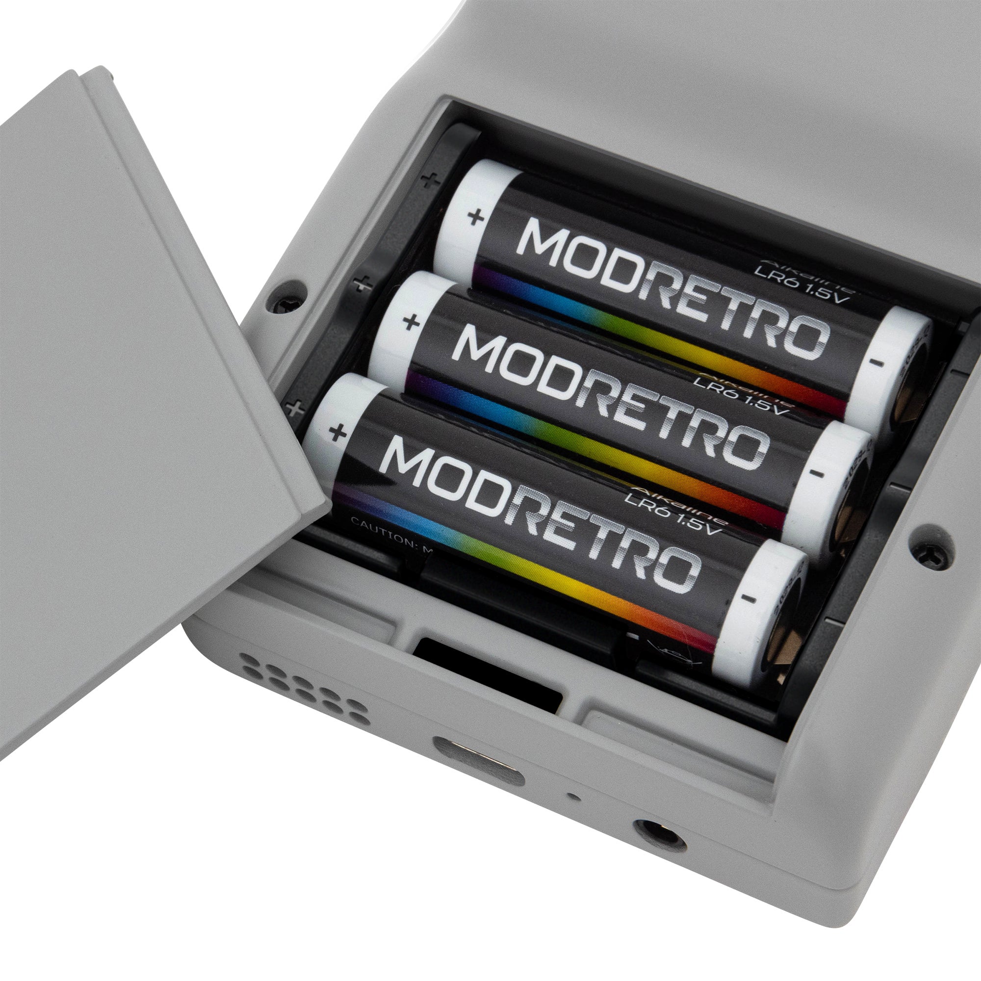 The back of a grey Chromatic unit, powered by three double-A batteries. - 3