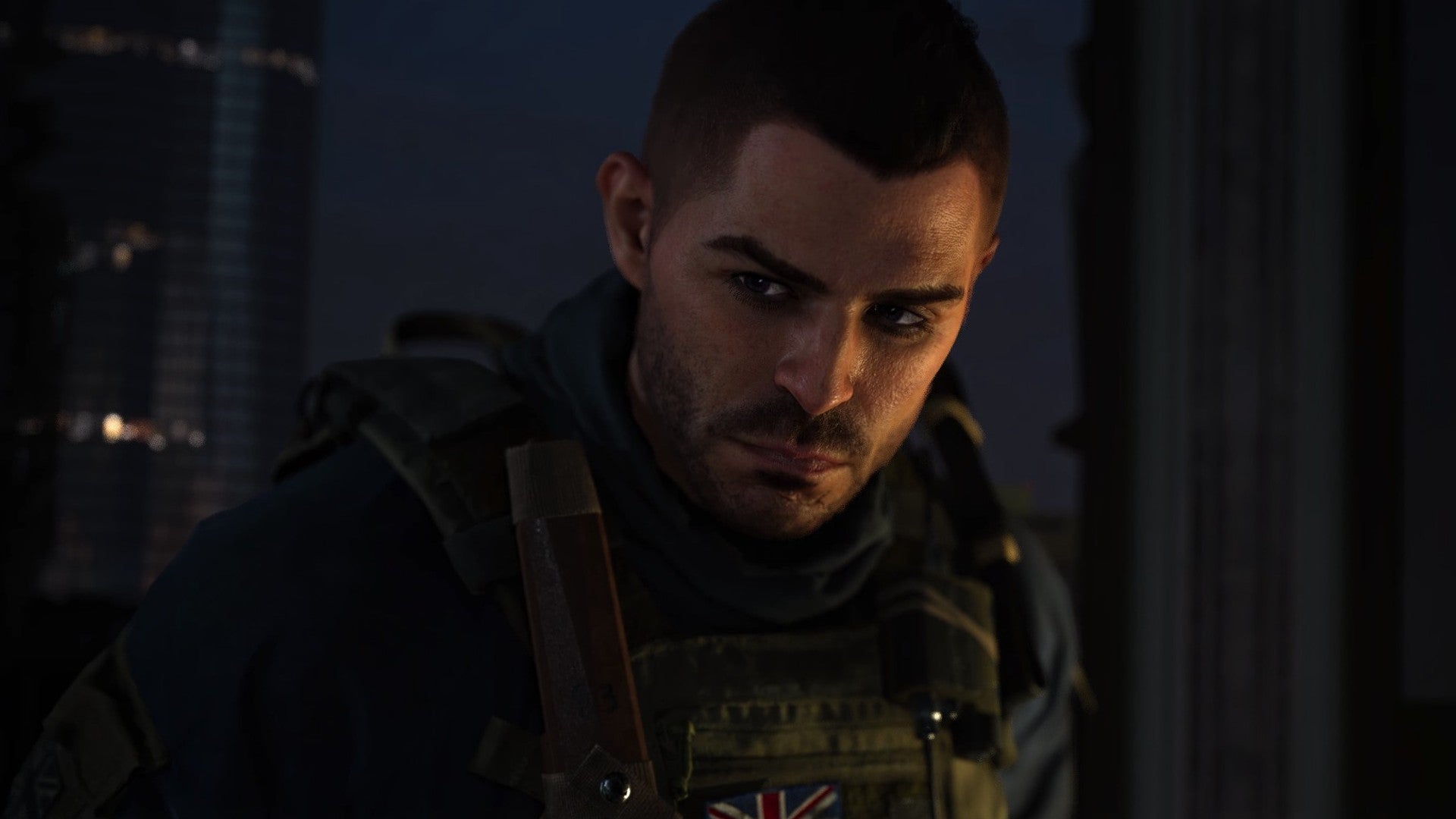 Modern Warfare 2 image showing Soap leaning slightly forward while scowling in the dark.