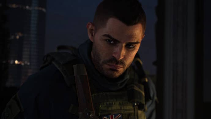 Modern Warfare 2 image showing Soap leaning slightly forward while scowling in the dark.