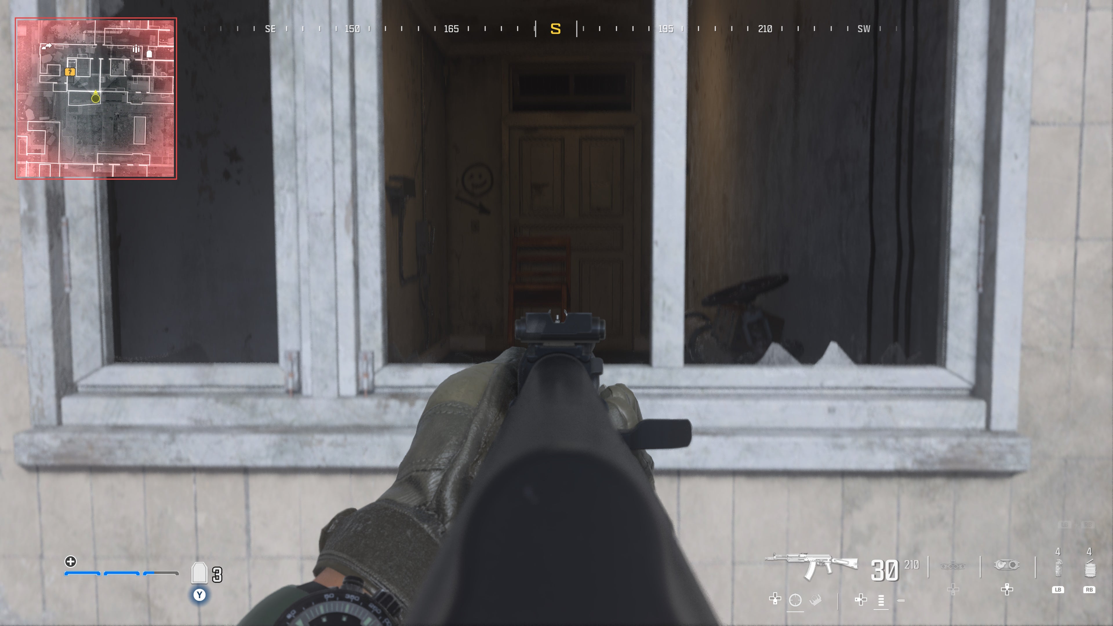 looking through a window at a chair blocking a door