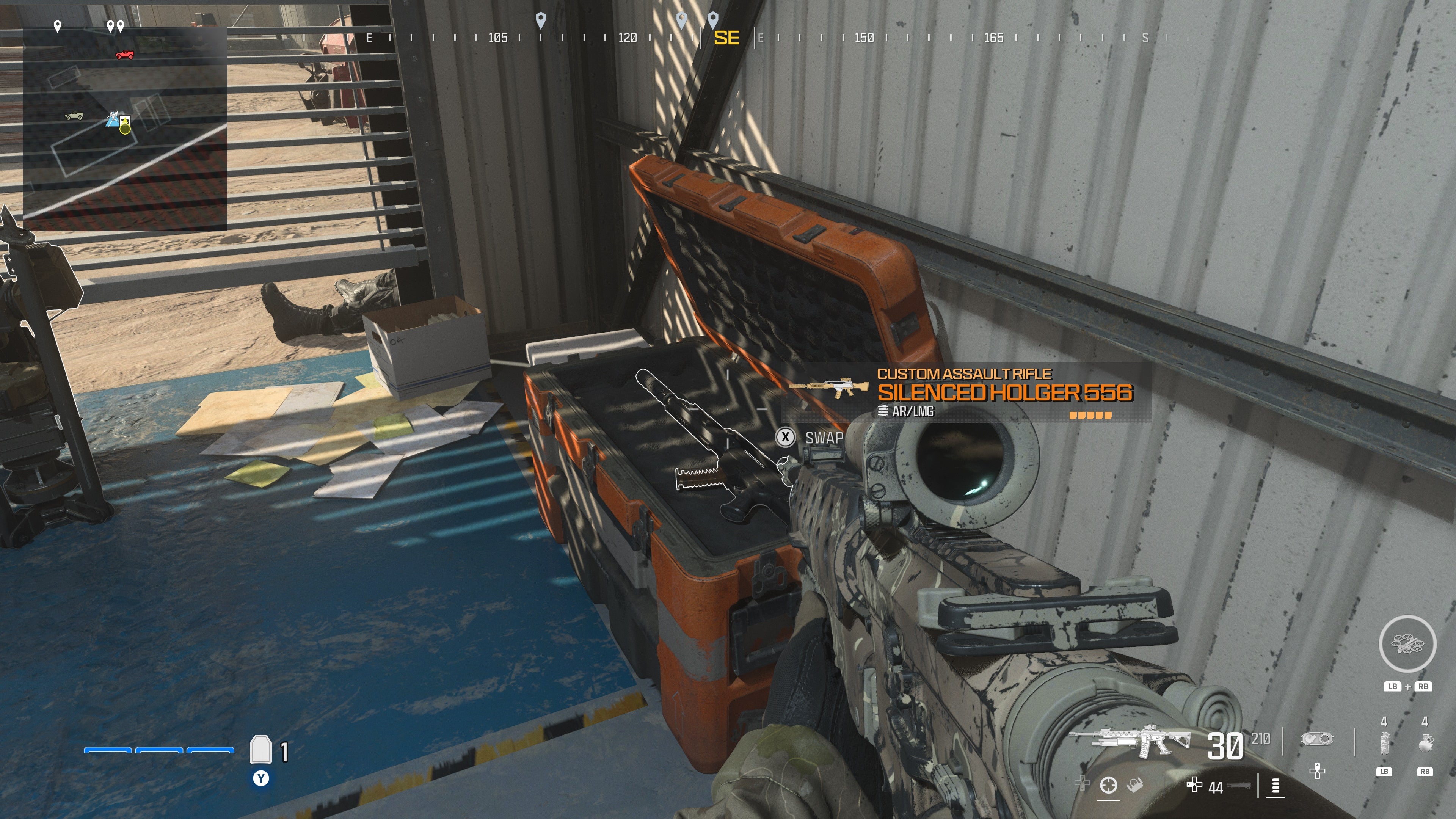 looking at an item in an open orange supply box on the reactor level