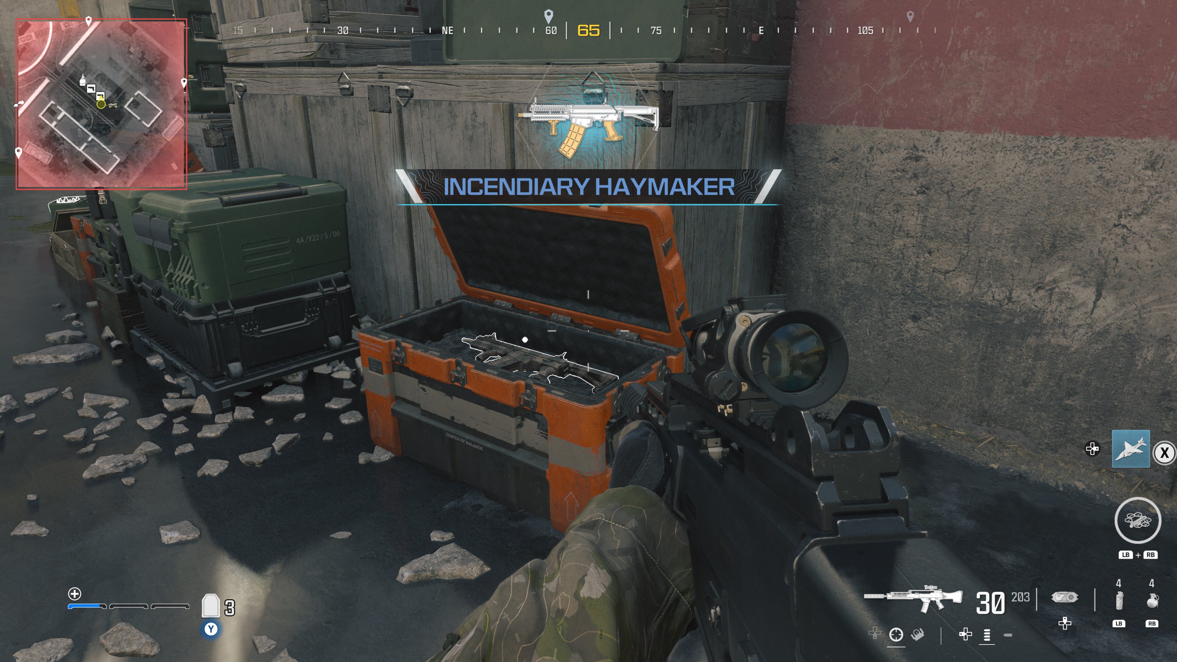 looking at an item in an open orange supply box on the reactor level