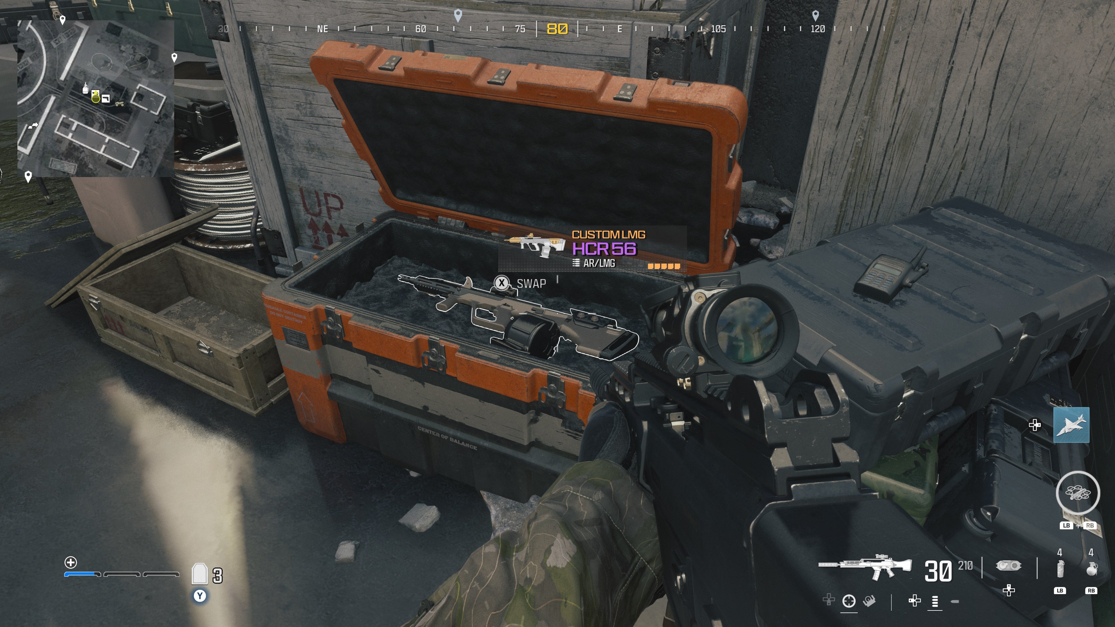 looking at an item in an open orange supply box on the reactor level