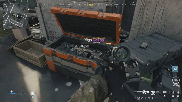 looking at an item in an open orange supply box on the reactor level