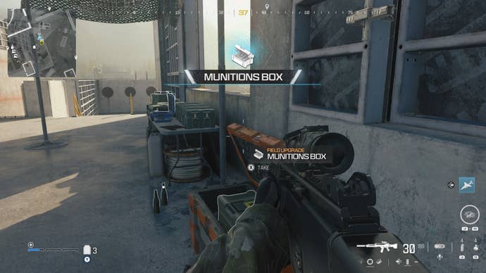 looking at an item in an open orange supply box on the reactor level