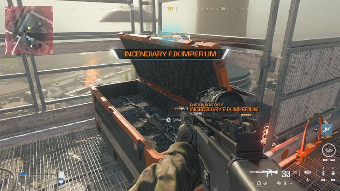 looking at an item in an open orange supply box on the reactor level