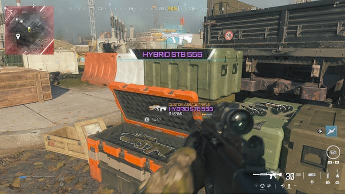 looking at an item in an open orange supply box on the reactor level