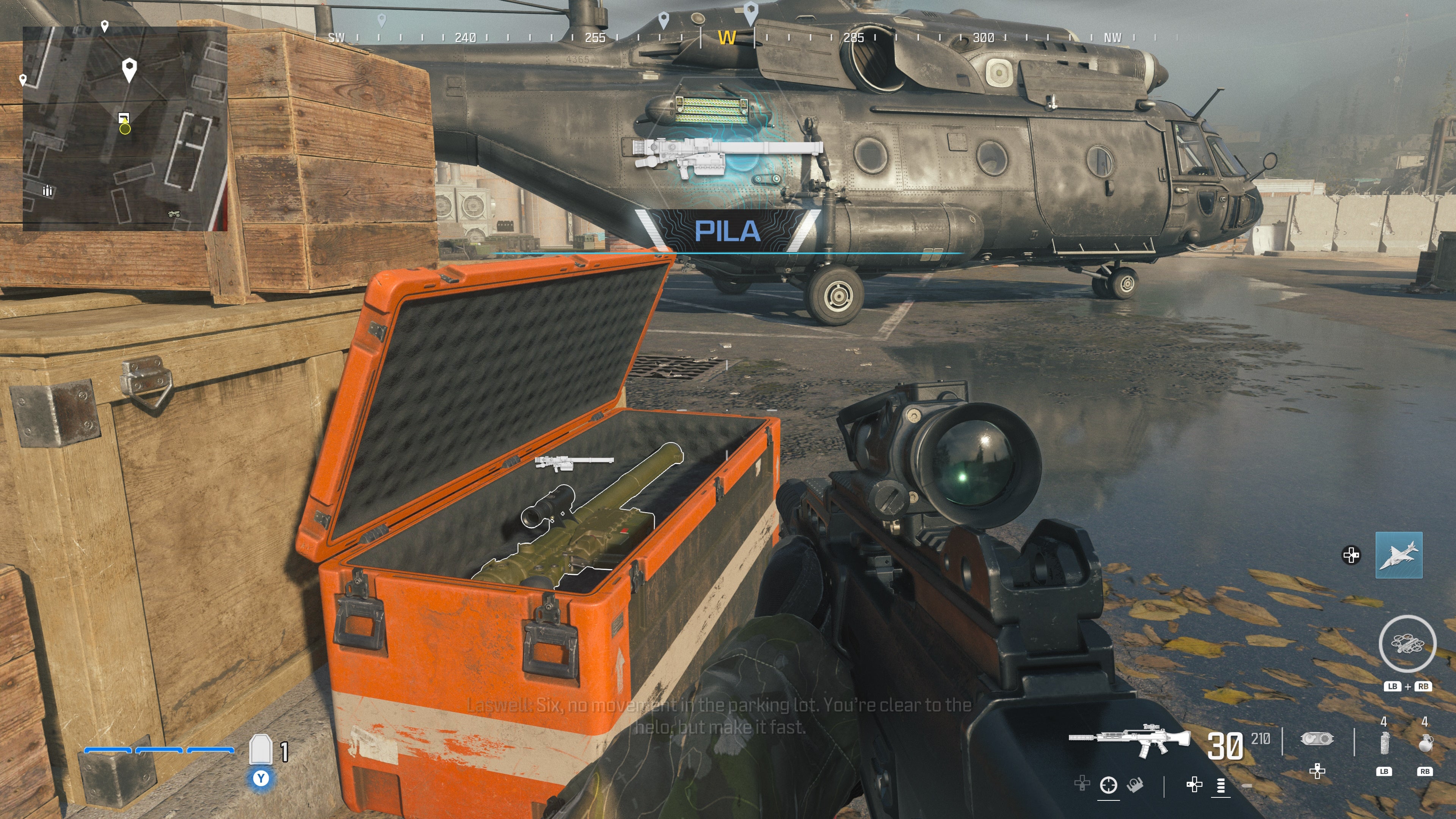 looking at an item in an open orange supply box on the reactor level