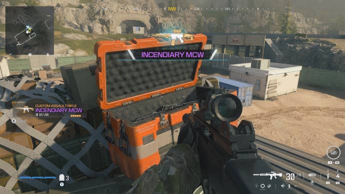 looking at an item in an open orange supply box on the reactor level