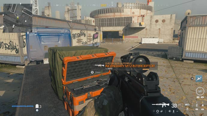 looking at an item in an open orange supply box on the reactor level